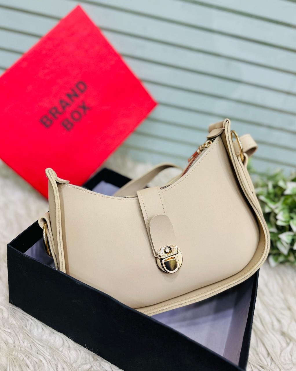 The Crescent Lock Shoulder Bag
