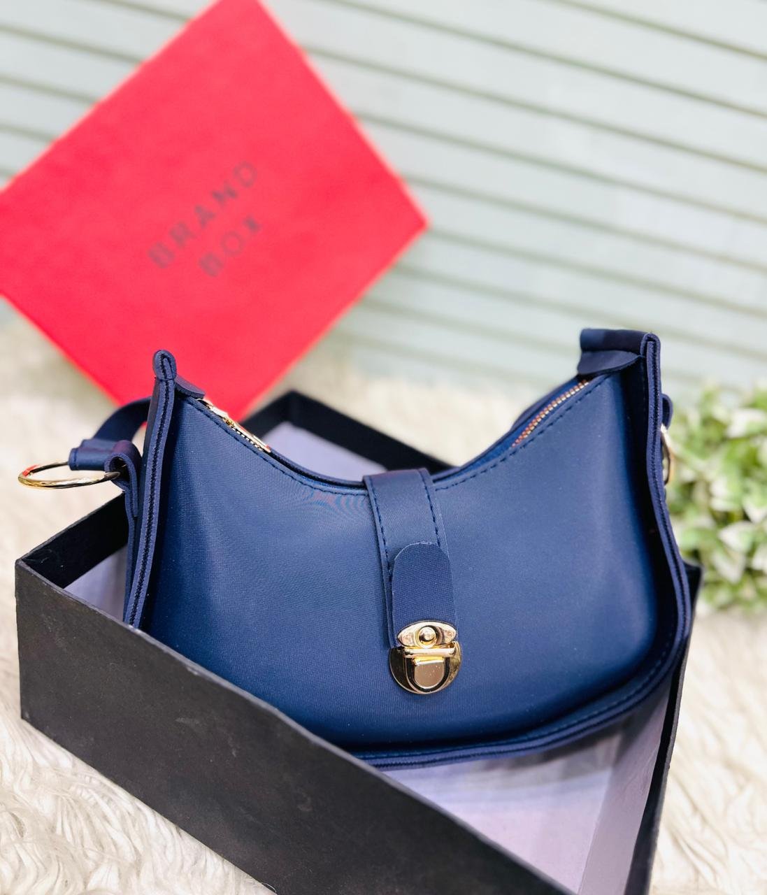 The Crescent Lock Shoulder Bag