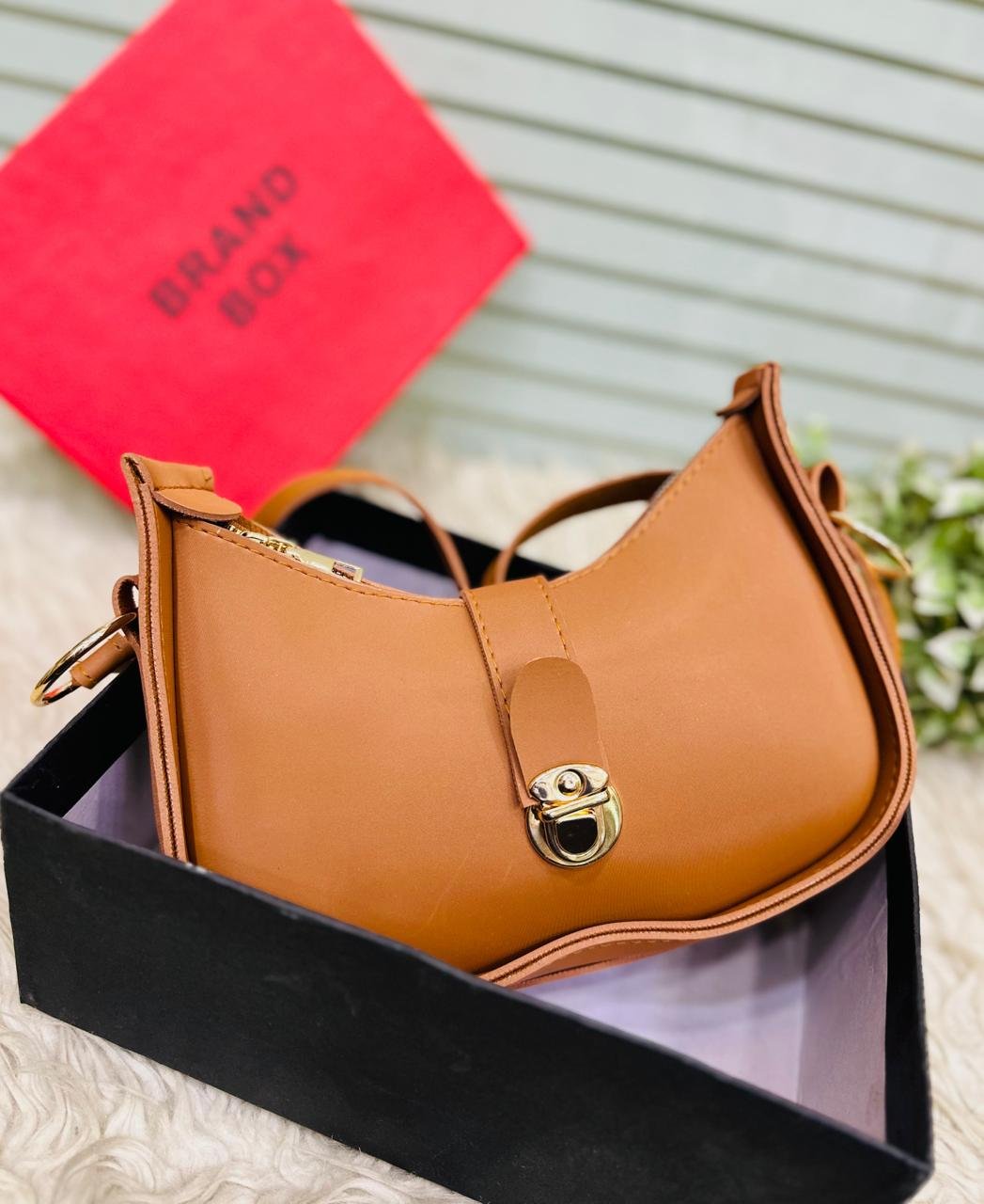 The Crescent Lock Shoulder Bag