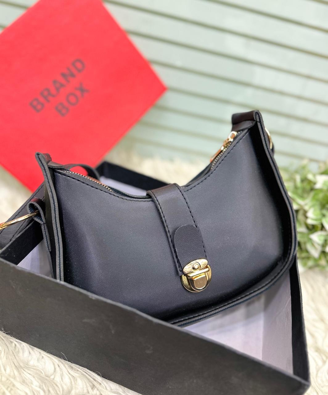 The Crescent Lock Shoulder Bag