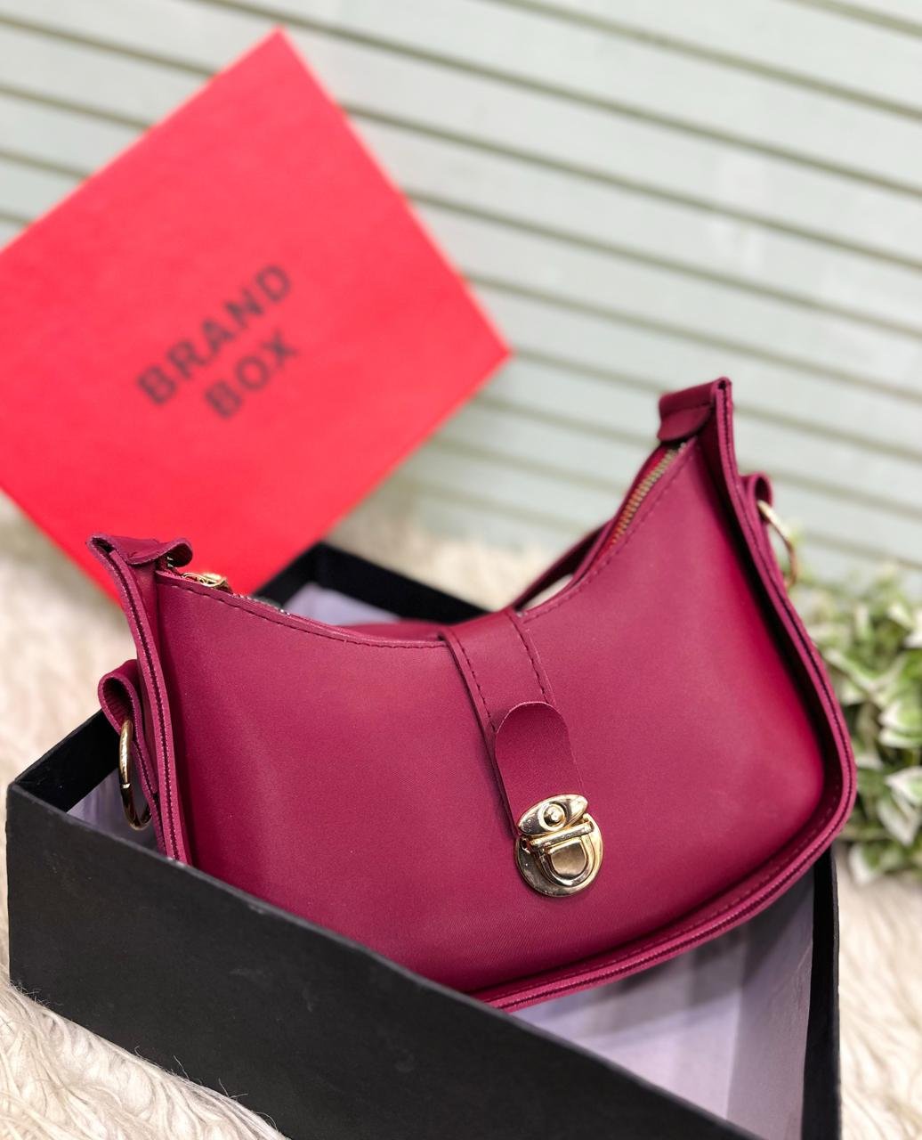 The Crescent Lock Shoulder Bag